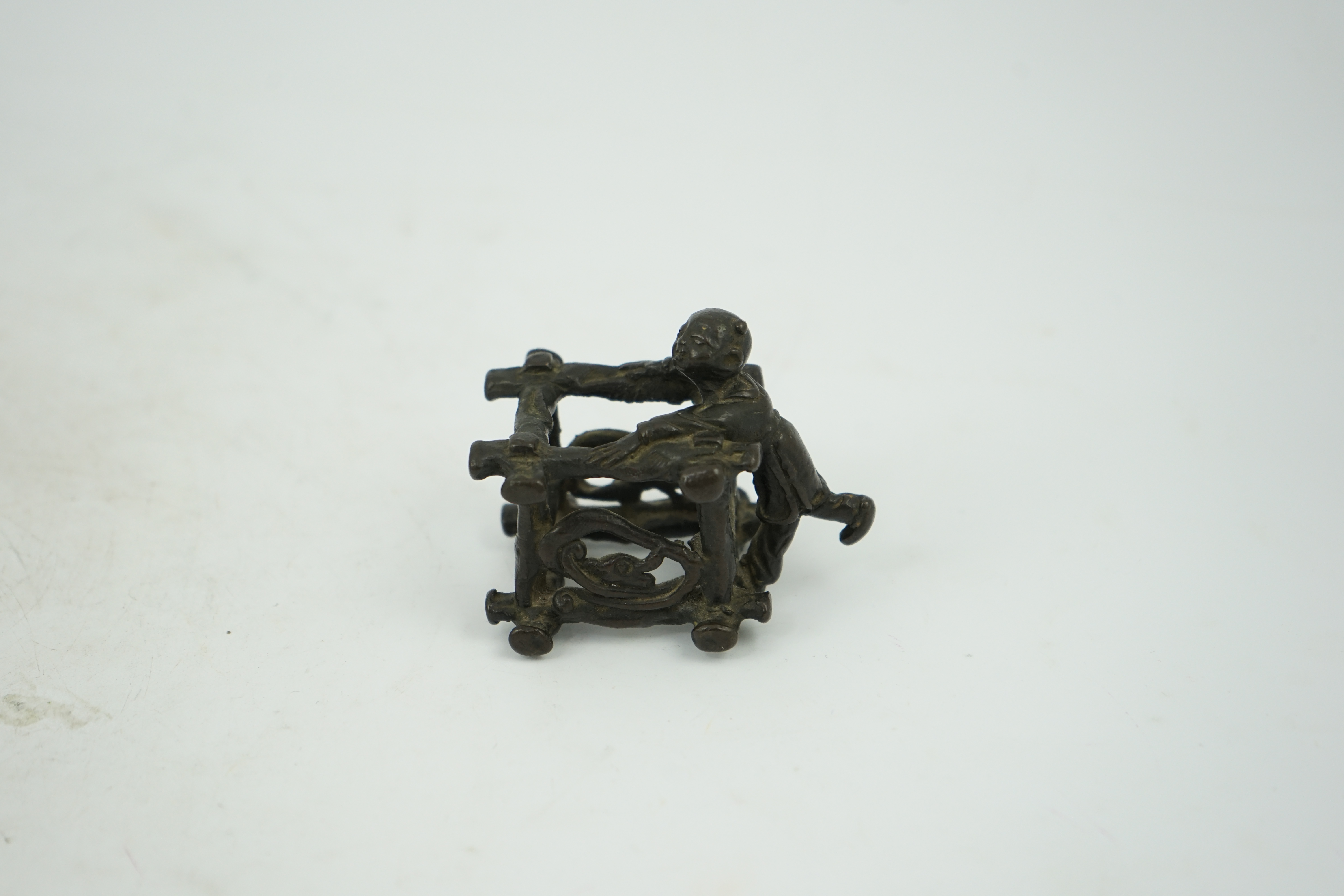 A Chinese bronze figural scroll weight, late Ming